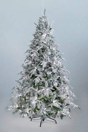 Ель Маттерхорн заснеженная с вплетенной гирляндой- настоящие произведение искусства. Ветви вылнены из ПВХ пленки и резины зеленого цвета с имитацией снега, которые придают поистене новогоднее настроение. Фиксированный на стволе ветки этой неповторимой кра